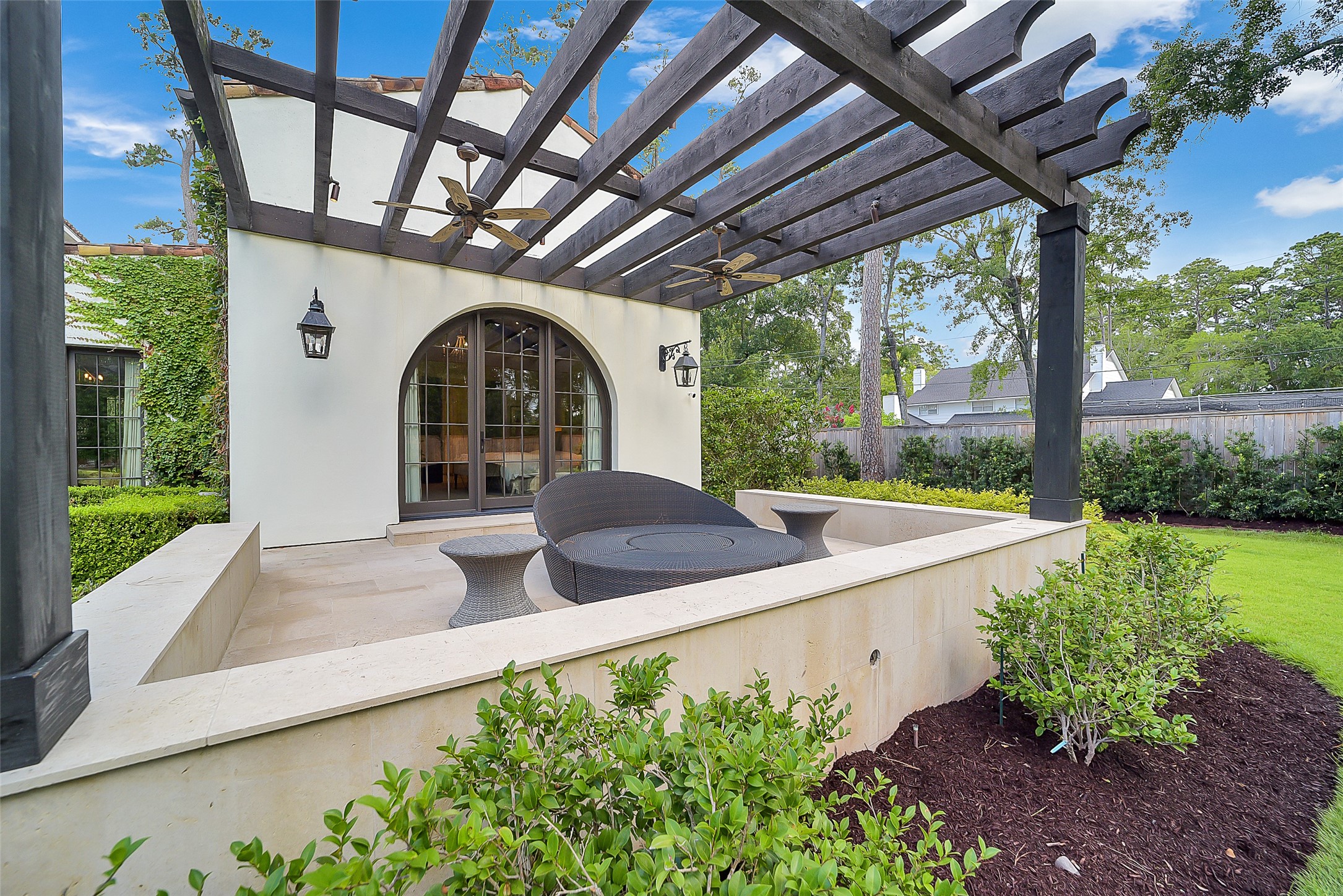 252 Piney Point Road Houston, TX 77024 - Photo 15 of 46 A lovely private terrace extends from the primary suite, offering a serene outdoor retreat with elevated views.