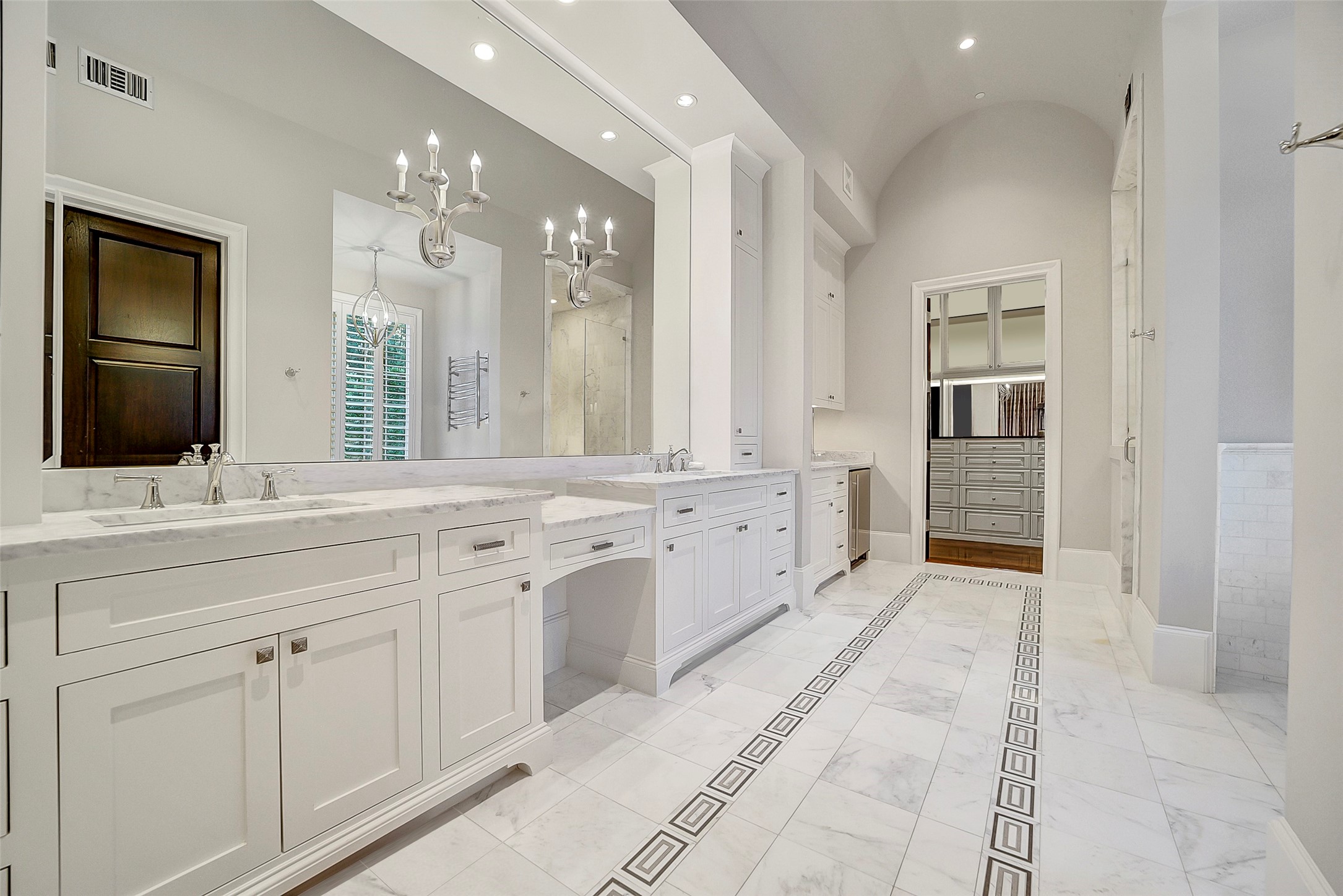 252 Piney Point Road Houston, TX 77024 - Photo 16 of 46 A true retreat, the primary bathroom showcases double under-mount sinks and custom designer details. Additional amenities include a thoughtfully integrated coffee bar.