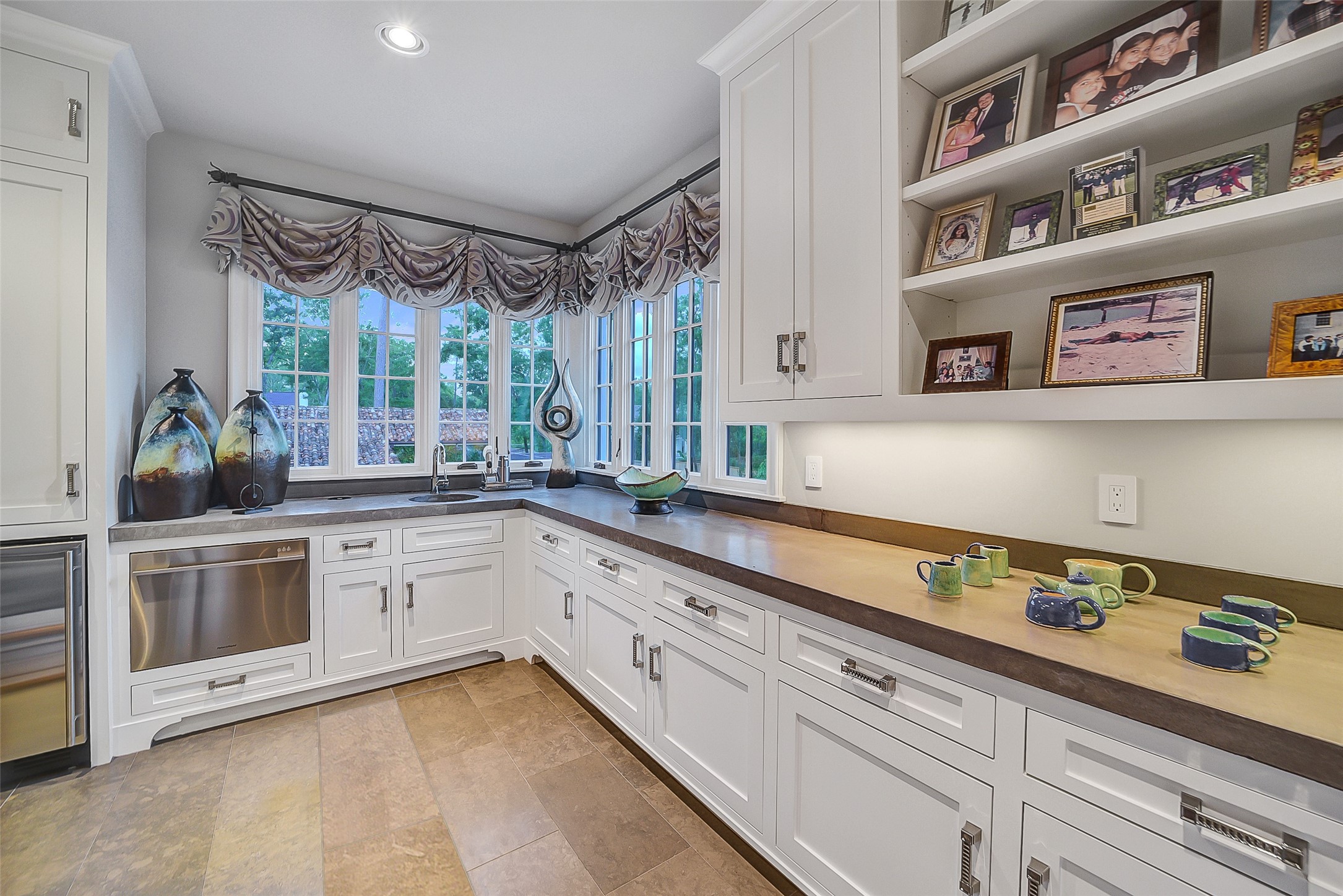 252 Piney Point Road Houston, TX 77024 - Photo 23 of 46 The game room kitchen is designed for convenience and boasts cement countertops, refrigerator, dishwasher, and separate ice maker.