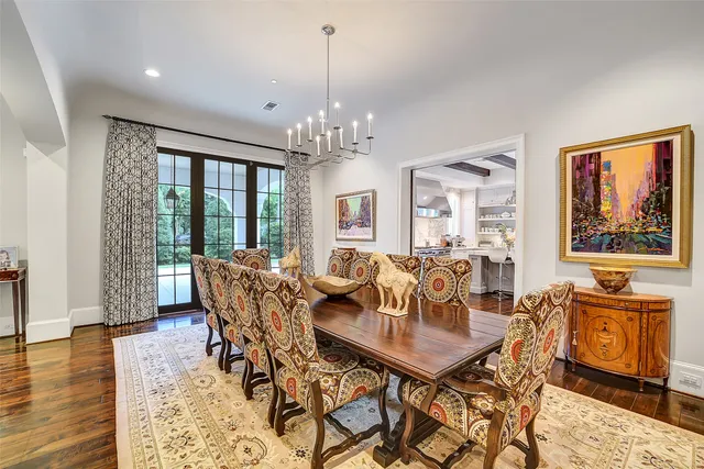 a front view of a house with garden and patio
