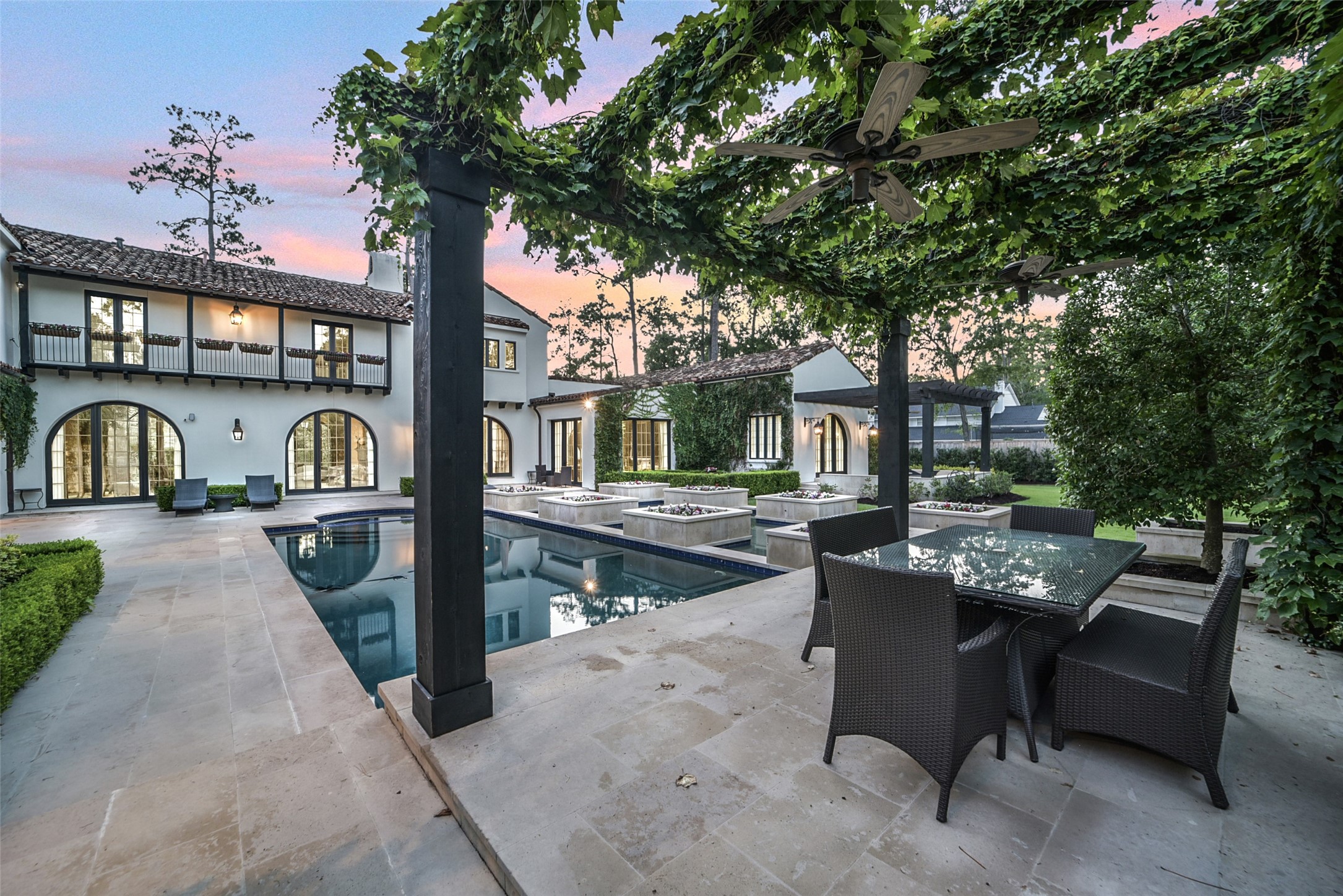 252 Piney Point Road Houston, TX 77024 - Photo 27 of 46 Enjoy mornings, afternoons, and evenings beneath the charming arbor- an ideal setting for dining and entertaining with family and friends.