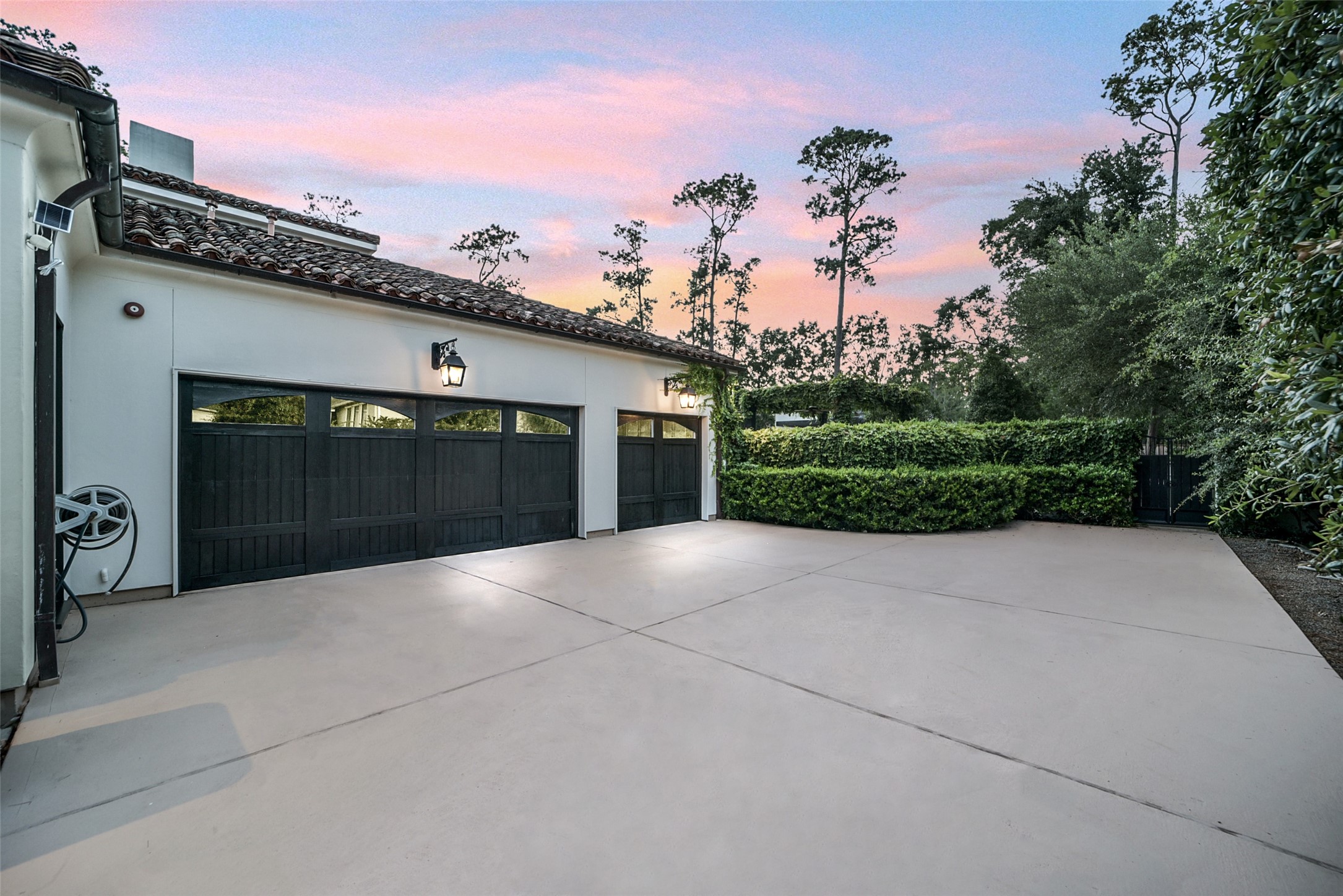 252 Piney Point Road Houston, TX 77024 - Photo 32 of 46 The state-of-the-art, expansive three-car garage features wood lined doors, tiled floors, 11kw EV charger, air conditioning, and excellent built-in storage.