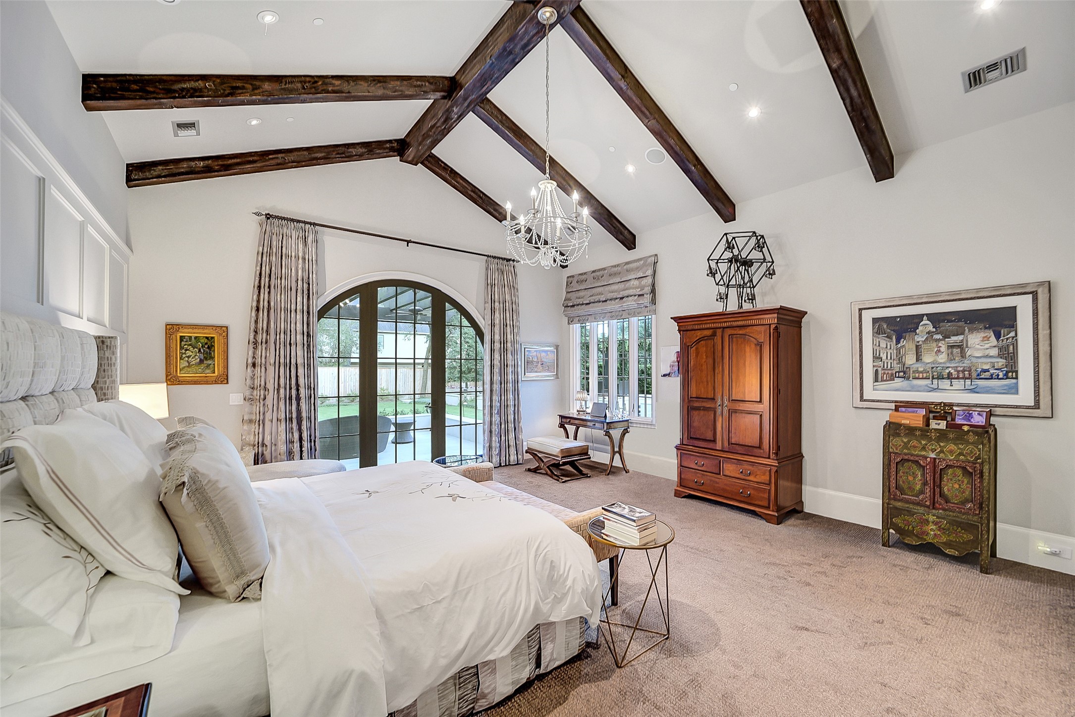 252 Piney Point Road Houston, TX 77024 - Photo 37 of 46 Another view of the primary suite boasts expansive glass doors that open to the terrace and manicured backyard.