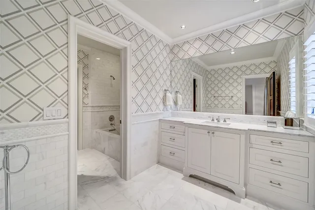 a bedroom with a bed wooden floor and lamp