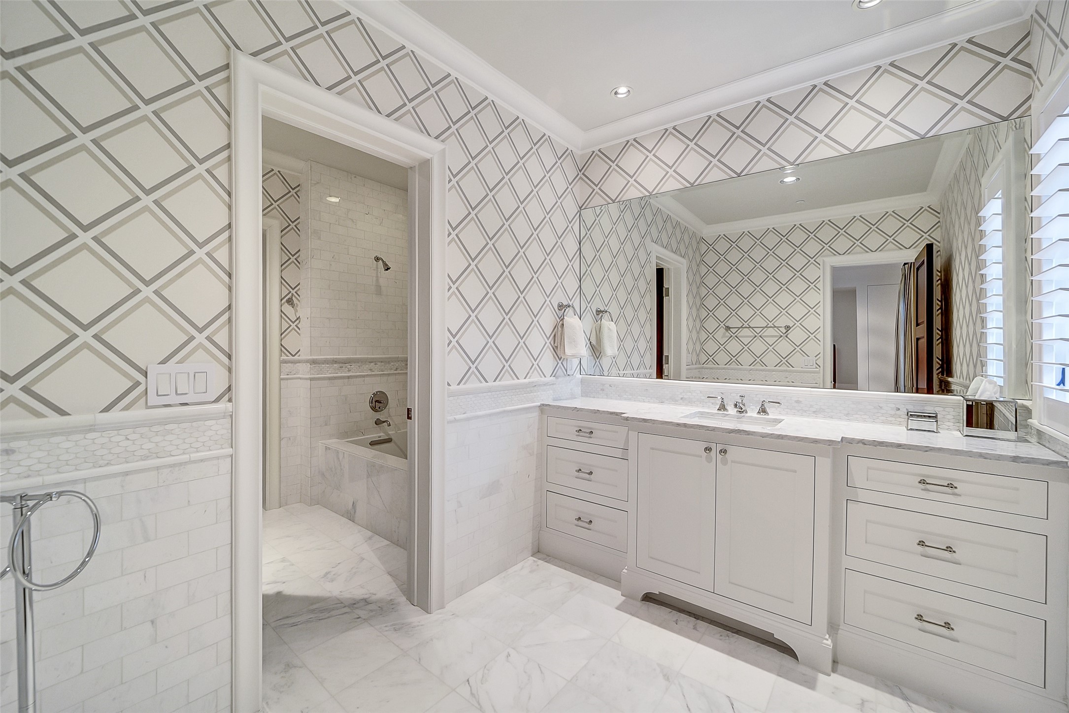 252 Piney Point Road Houston, TX 77024 - Photo 39 of 46 The private en-suite bathrooms are beautifully appointed with marble and designer tile finishes.