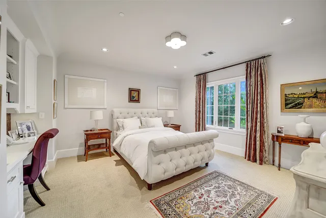 a spacious bathroom with a granite countertop sink mirror and double