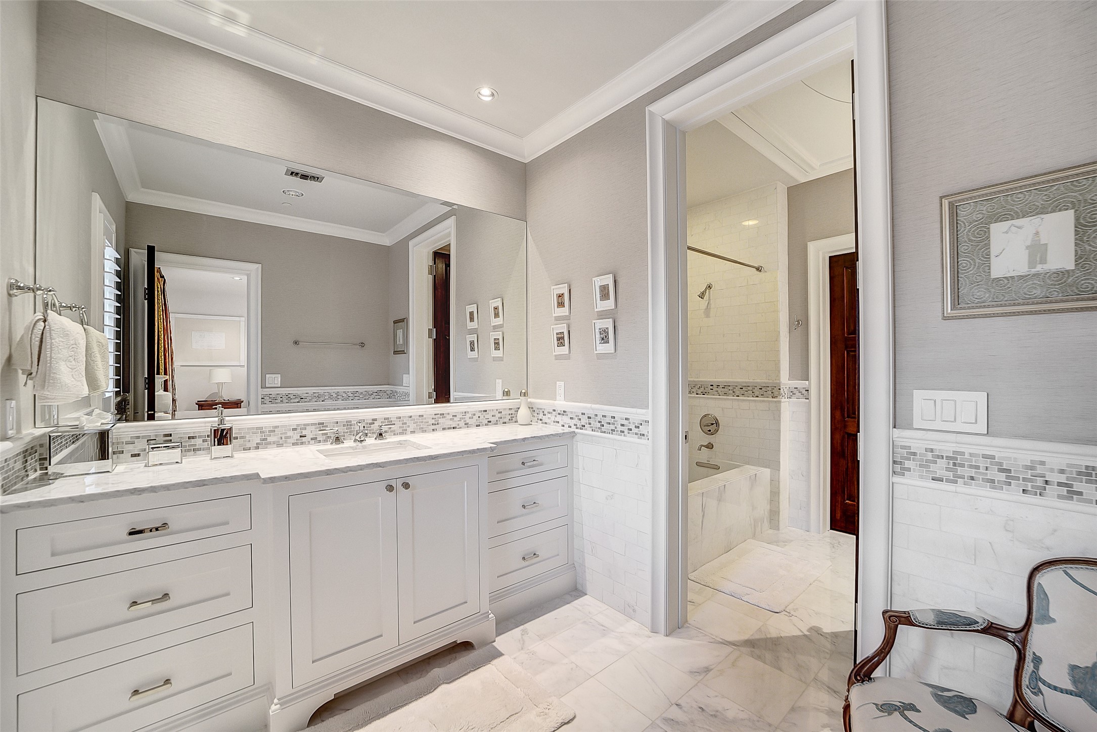 252 Piney Point Road Houston, TX 77024 - Photo 41 of 46 The en-suite bathroom offers refined detailing and sophistication.