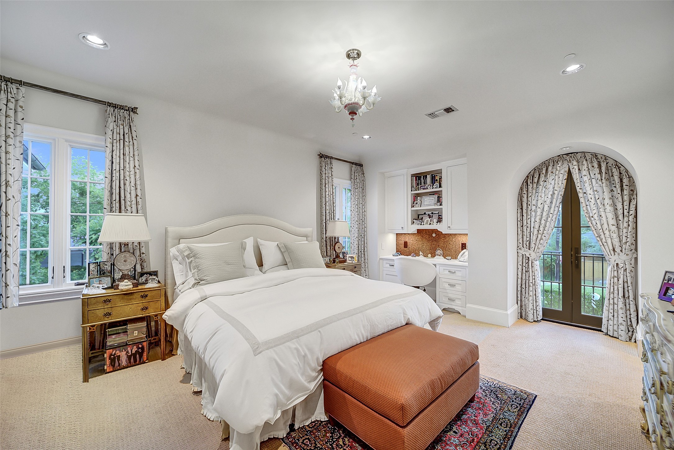 252 Piney Point Road Houston, TX 77024 - Photo 42 of 46 This corner bedroom is wrapped in windows and opens to a charming Juliet balcony filling the space with natural light.