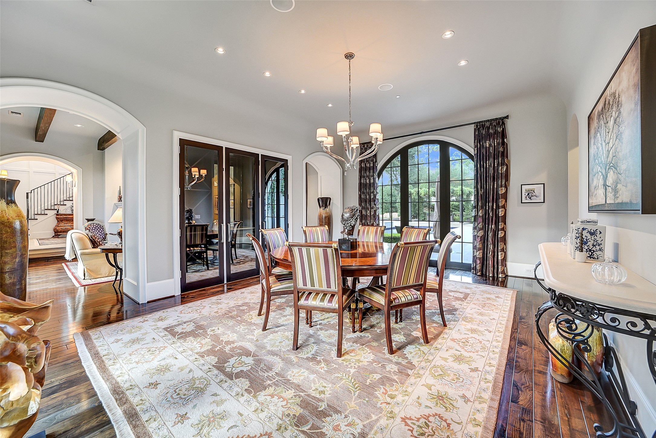 252 Piney Point Road Houston, TX 77024 - Photo 5 of 46 The abundant formal dining boasts a bespoke three-door wine closet with dedicated tasting shelf.