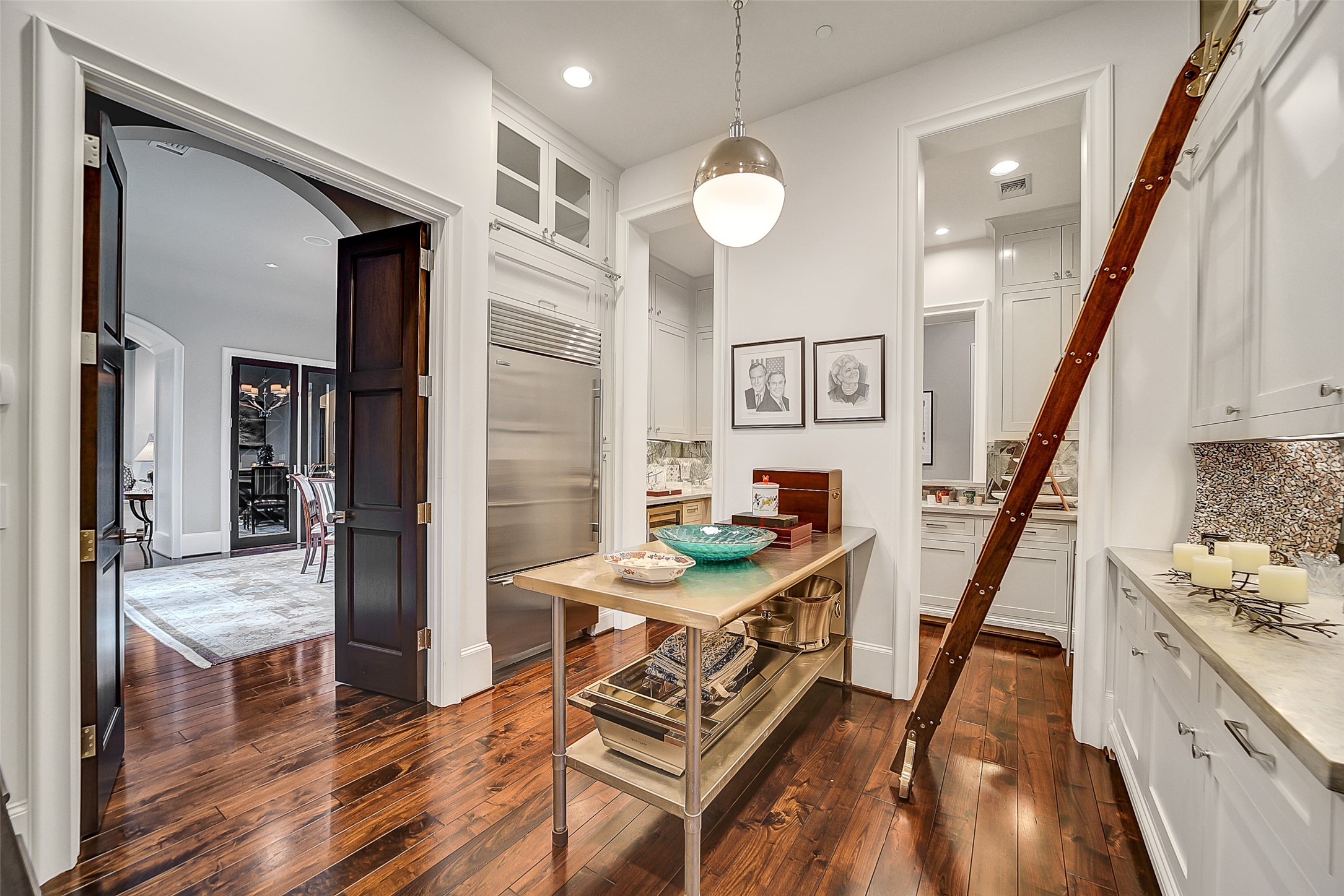 252 Piney Point Road Houston, TX 77024 - Photo 9 of 46 Expansive Butler's Pantry is adjacent to the wet bar, and includes an additional Sub-Zero refrigerator. This is a perfect area to prep. The wet bar includes a wine bar and chilling area.