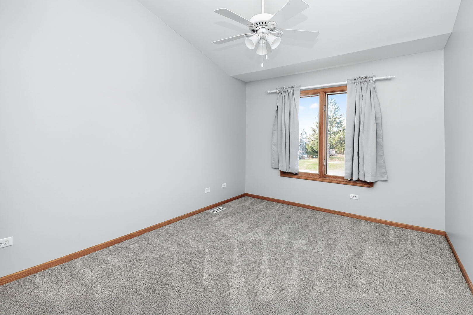 110 Harper Lane Lemont, IL 60439 - Photo 16 of 29 an empty room with windows and fan
