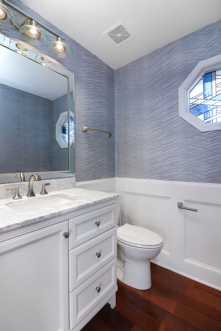 110 Harper Lane Lemont, IL 60439 - Photo 21 of 29 a bathroom with a toilet a sink and mirror