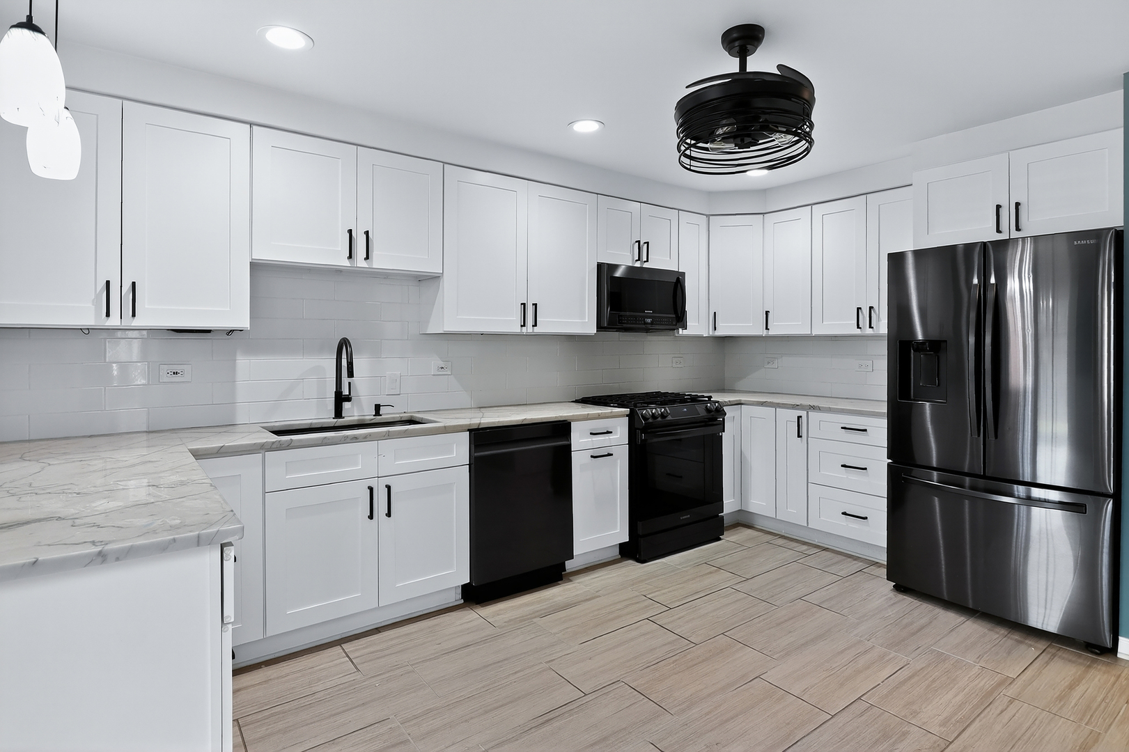 110 Harper Lane Lemont, IL 60439 - Photo 4 of 29 a kitchen with stainless steel appliances granite countertop a sink stove and refrigerator