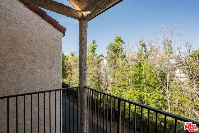 a view of a balcony with an outdoor space