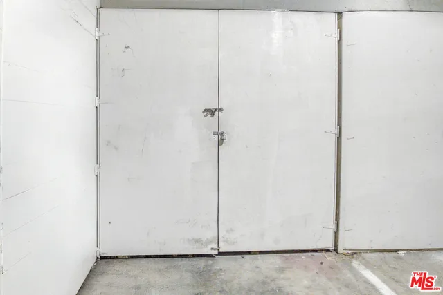 an aerial view of a house with garden space and street view