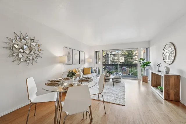 a view of a dining room with furniture window and wooden floor