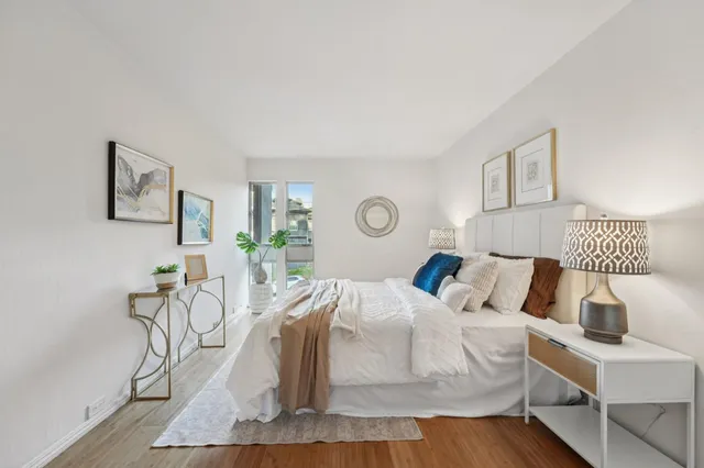 a bedroom with furniture and a table