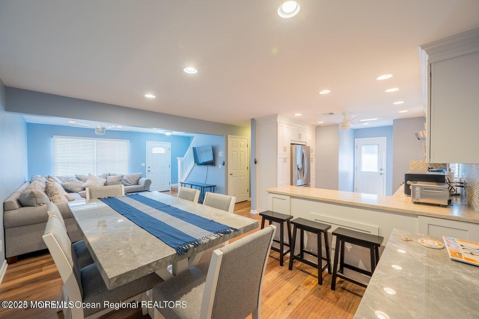 204 Coolidge Avenue Seaside Heights, NJ 08751 - Photo 15 of 22 a living room with stainless steel appliances furniture a rug and a kitchen view