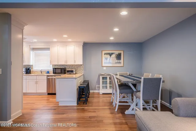 a kitchen with a table and chairs in it