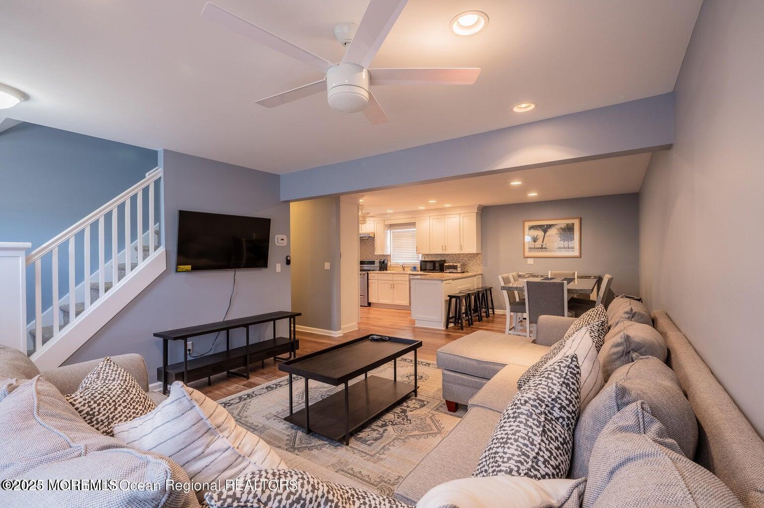 204 Coolidge Avenue Seaside Heights, NJ 08751 - Photo 20 of 22 a living room with furniture and a flat screen tv