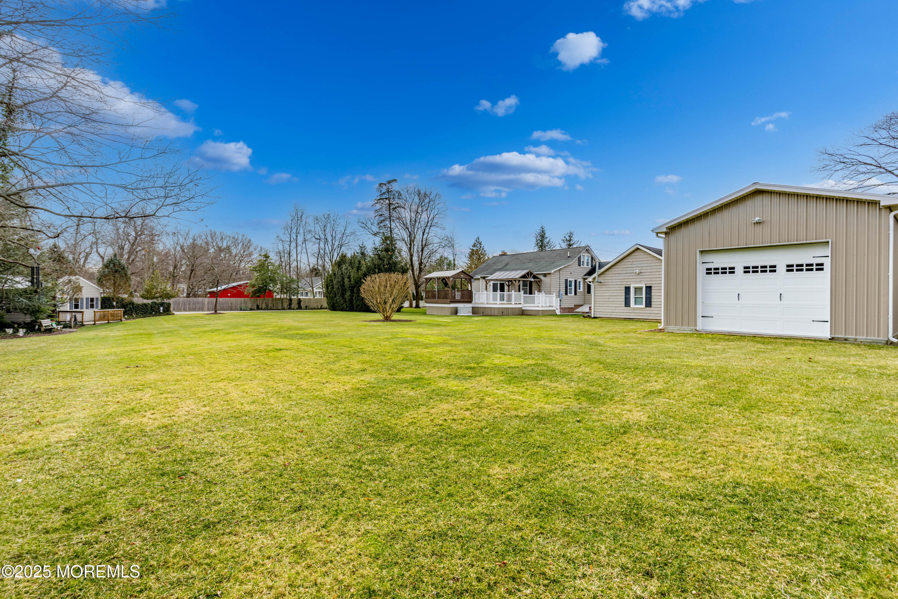 63 North New Prospect Road Jackson, NJ 08527 - Photo 12 of 43 a view of a swimming pool with an outdoor space and seating area