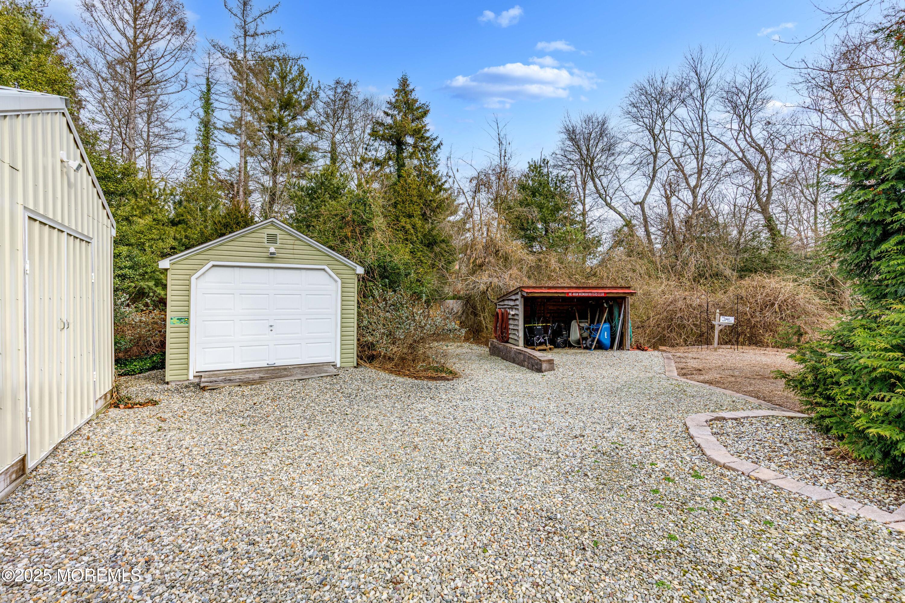 63 North New Prospect Road Jackson, NJ 08527 - Photo 43 of 43 a front view of a house with a yard and garage