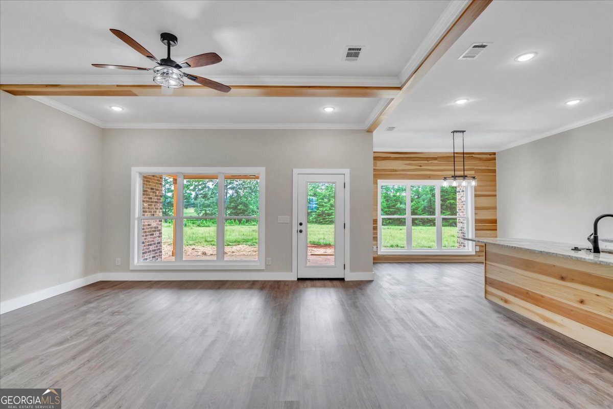 87 River Ridge Drive Hawkinsville, GA 31036 - Photo 16 of 65 a view of an empty room with wooden floor and a window