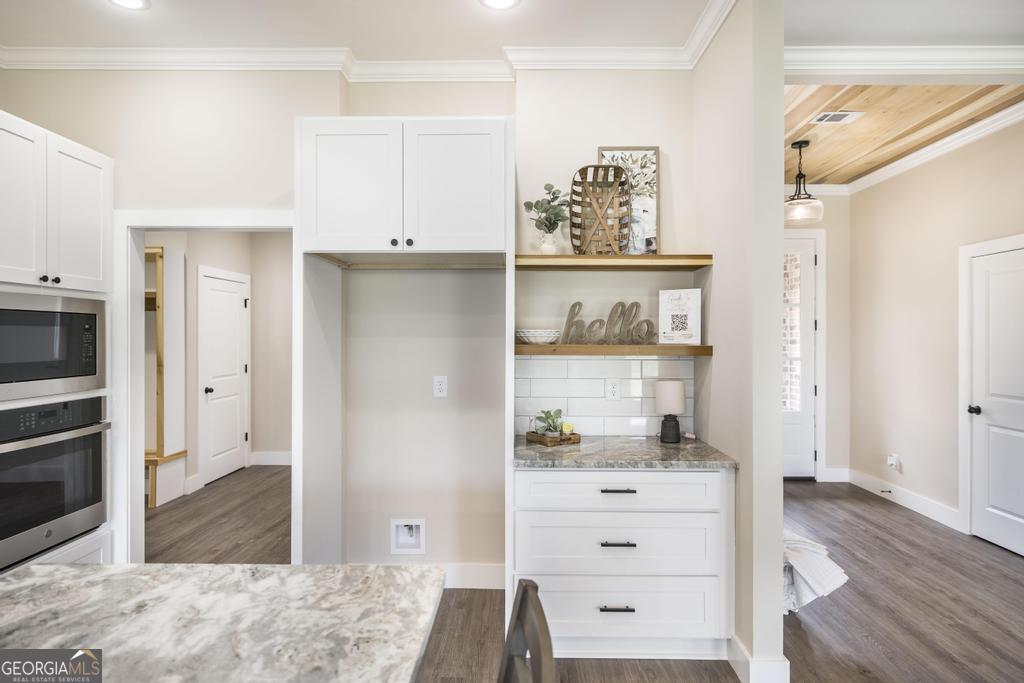 87 River Ridge Drive Hawkinsville, GA 31036 - Photo 19 of 65 a view of kitchen with wooden floor and cabinet