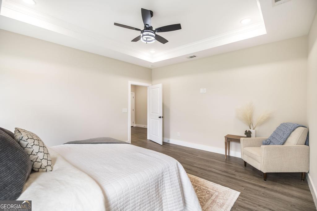87 River Ridge Drive Hawkinsville, GA 31036 - Photo 29 of 65 a bedroom with a bed furniture and a ceiling fan