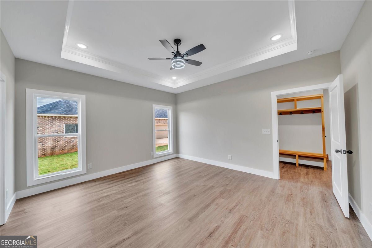 87 River Ridge Drive Hawkinsville, GA 31036 - Photo 32 of 65 wooden floor in an empty room with a window
