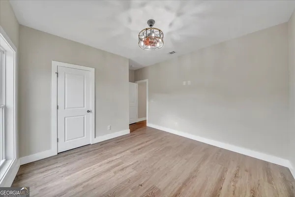 a view of an empty room and a window