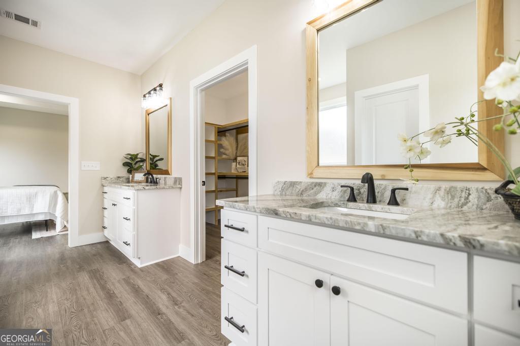 87 River Ridge Drive Hawkinsville, GA 31036 - Photo 37 of 65 a spacious bathroom with a granite countertop sink mirror and