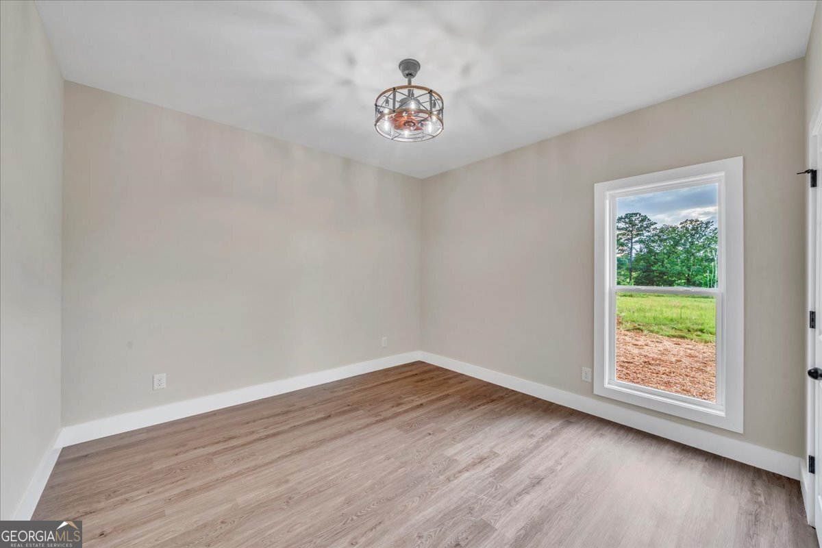 87 River Ridge Drive Hawkinsville, GA 31036 - Photo 61 of 65 a view of an empty room with a window