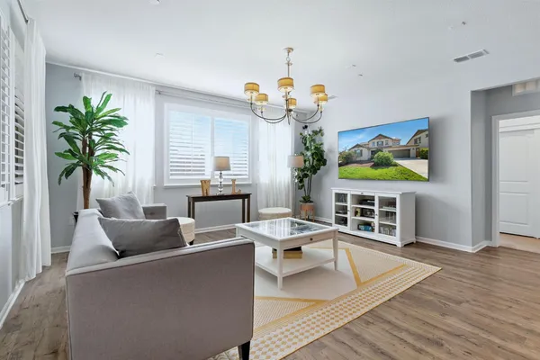 a dining room with furniture and window