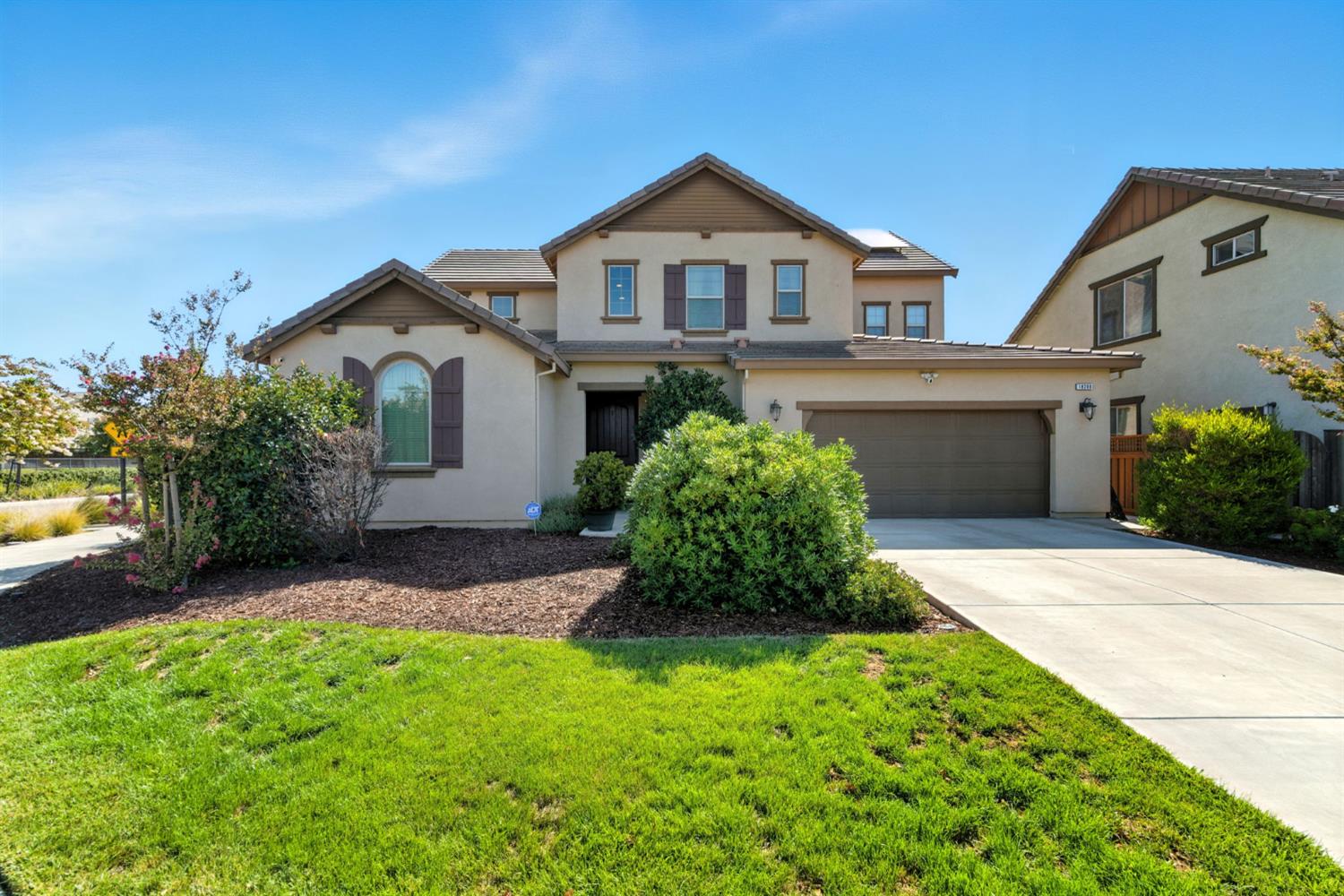 18200 Broadmoor Way Lathrop, CA 95330 - Photo 2 of 48 view of front of house featuring stucco siding, driveway, a garage, and a front lawn