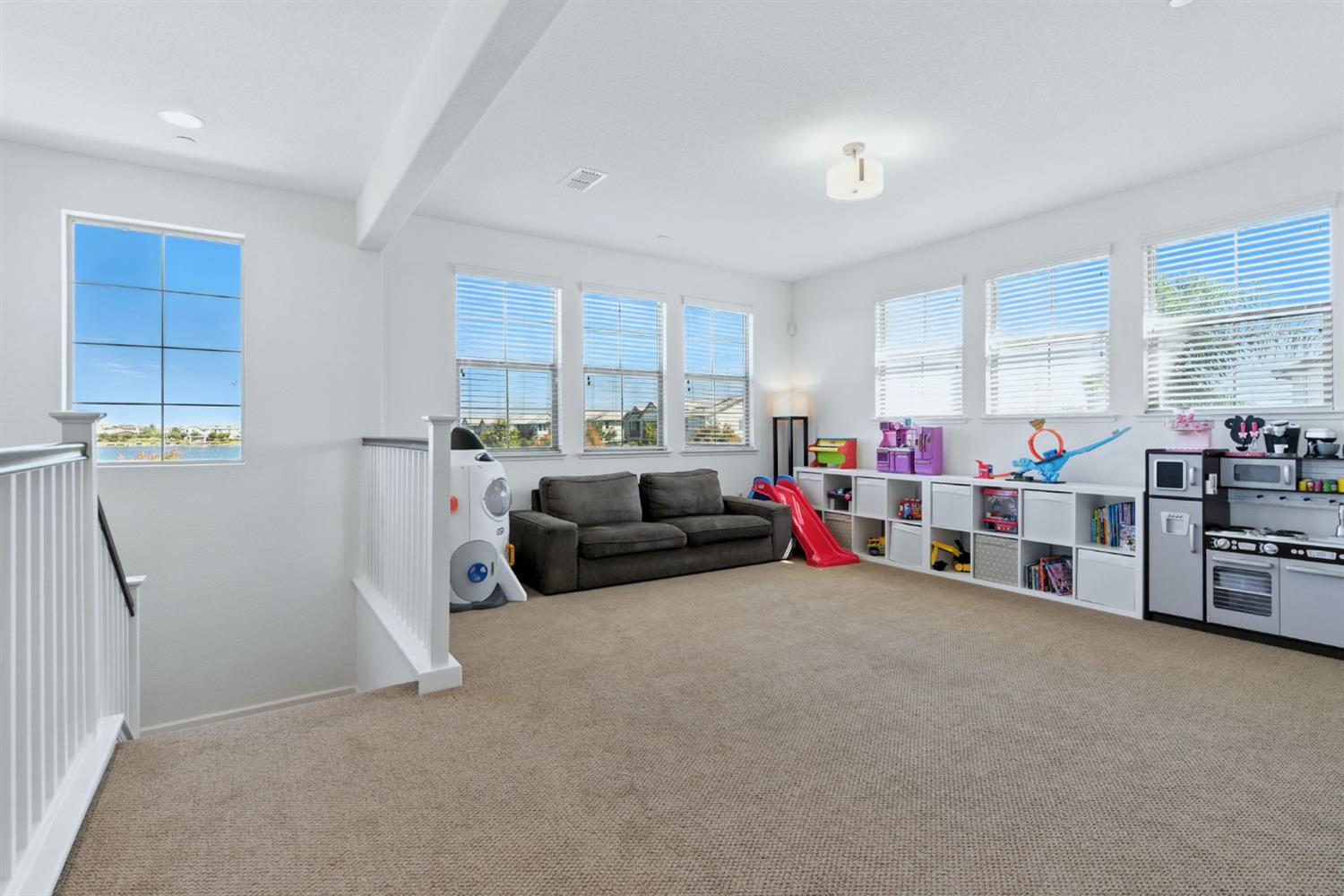 18200 Broadmoor Way Lathrop, CA 95330 - Photo 26 of 48 game room featuring plenty of natural light, carpet, and beam ceiling