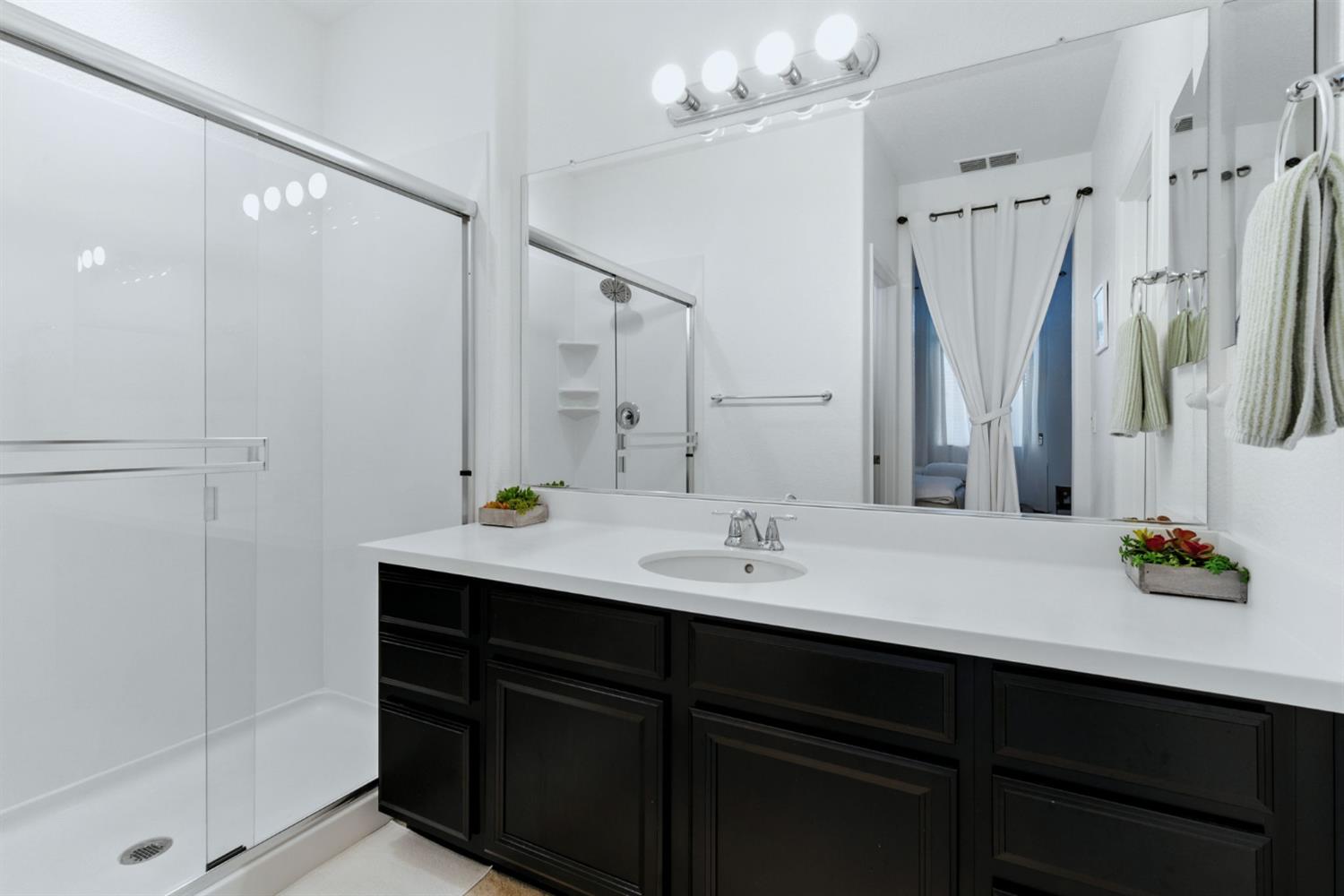 18200 Broadmoor Way Lathrop, CA 95330 - Photo 36 of 48 bathroom featuring a shower stall and vanity