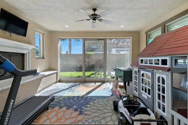 a view of a house with backyard and porch