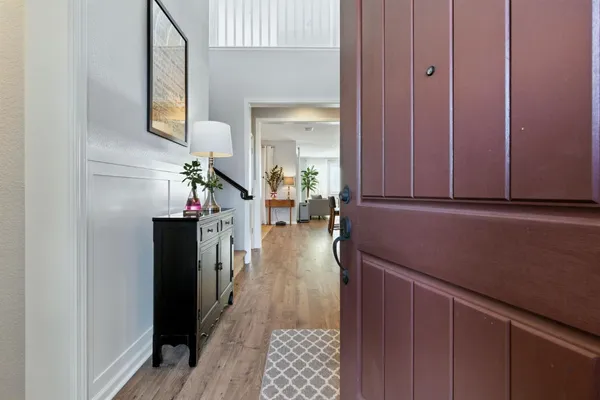 a hallway with a view of living room