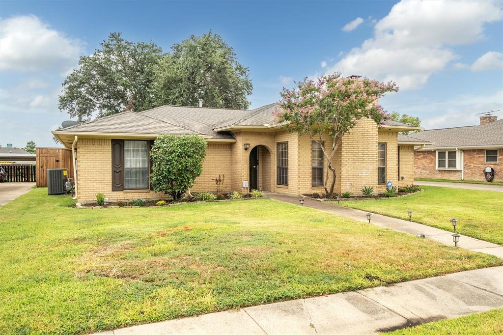 2214 Valley Mill Carrollton, TX 75006 - Photo 2 of 36 a front view of a house with garden