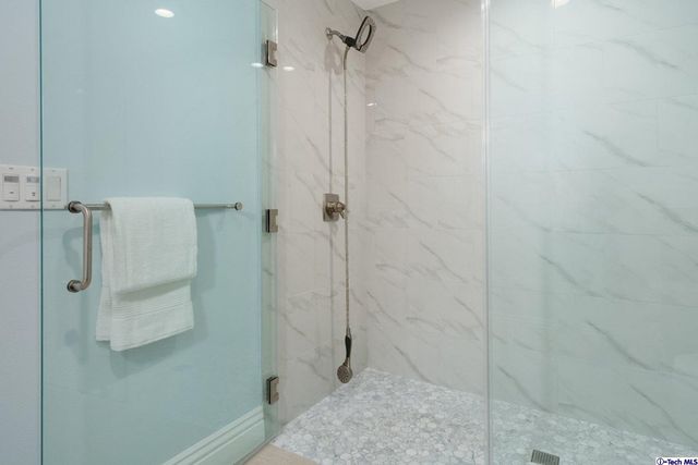 a bedroom with a bed and a potted plant