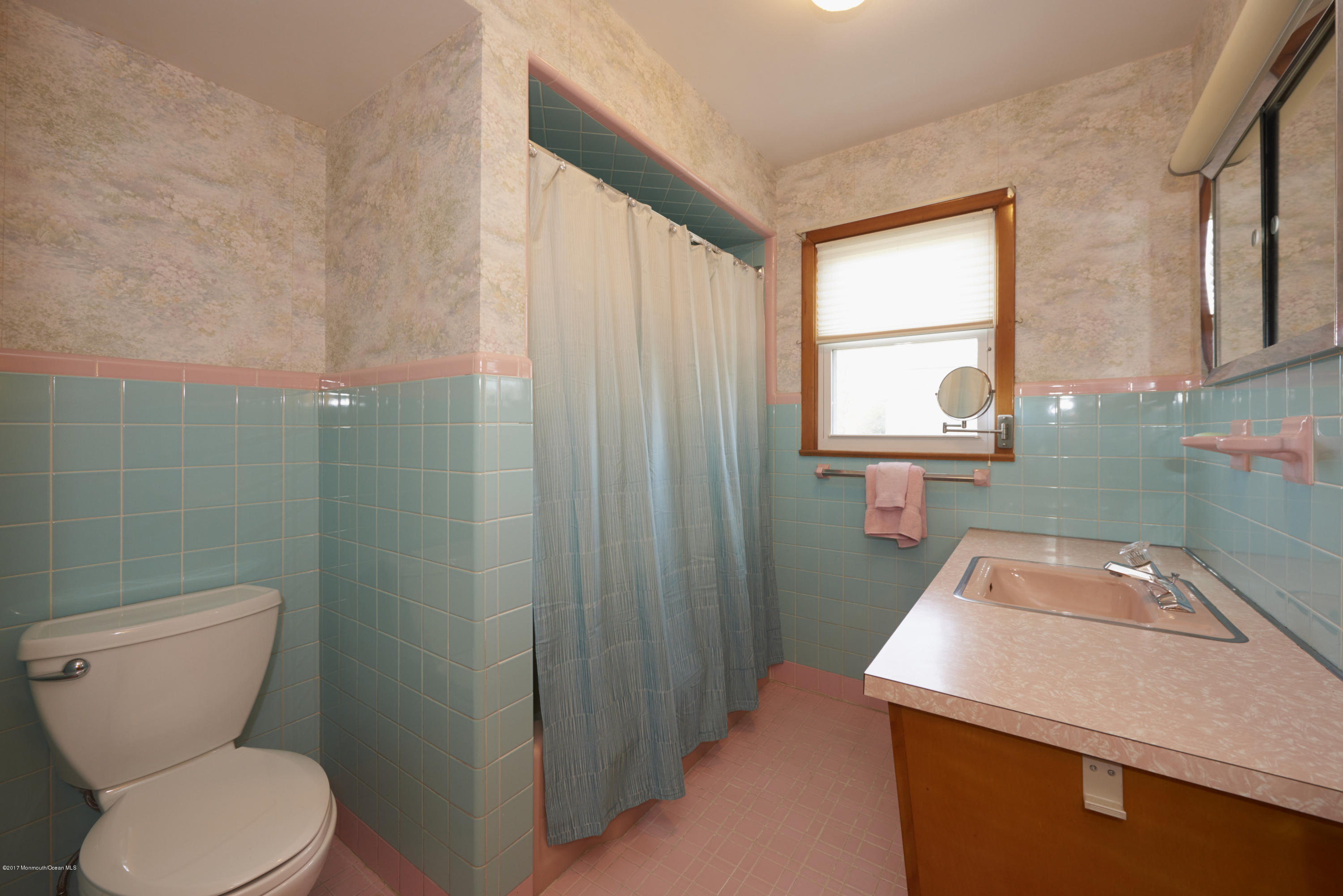 22 Maple Avenue Little Silver, NJ 07739 - Photo 12 of 25 a bathroom with a toilet sink and mirror