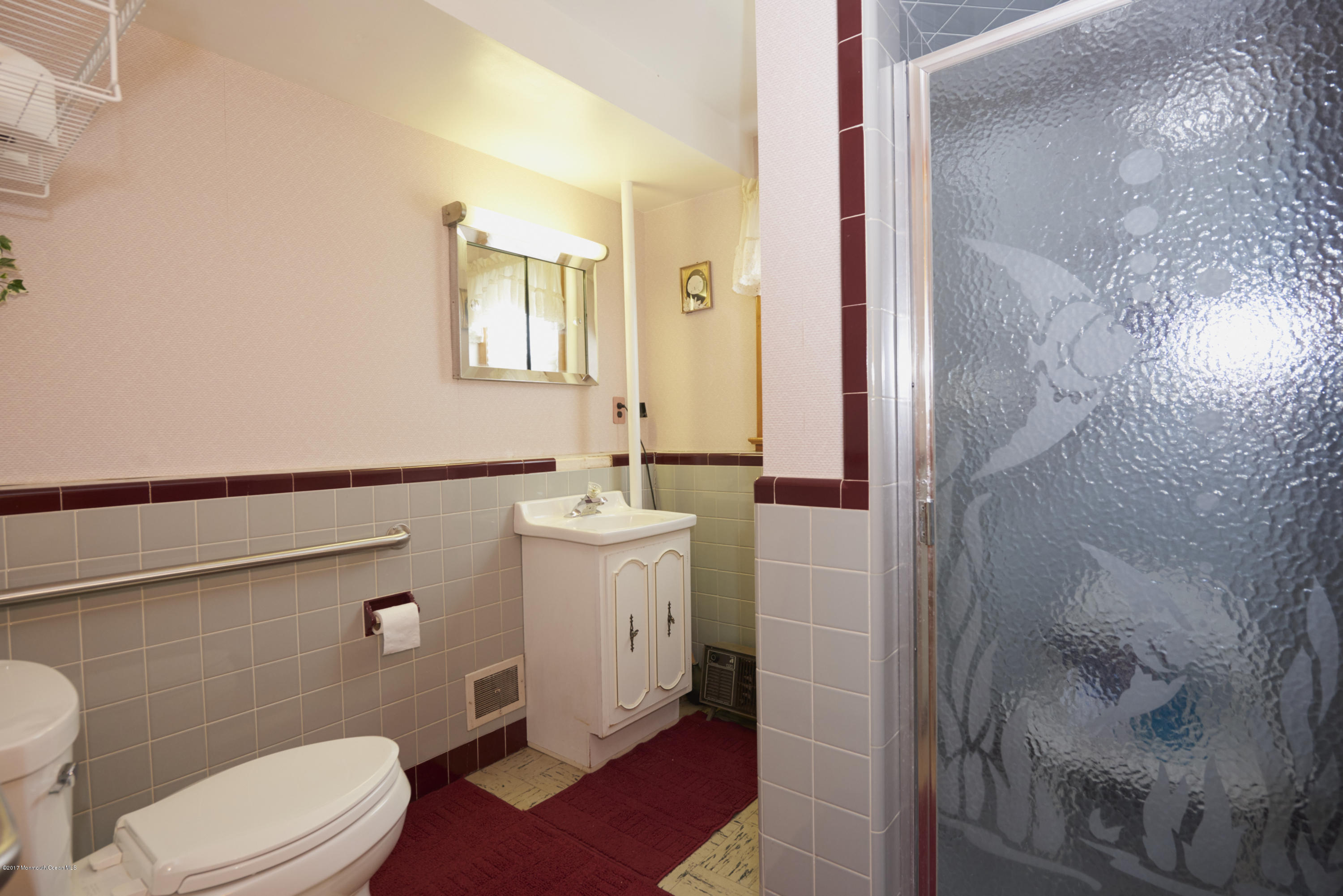 22 Maple Avenue Little Silver, NJ 07739 - Photo 17 of 25 a bathroom with a sink a toilet and shower
