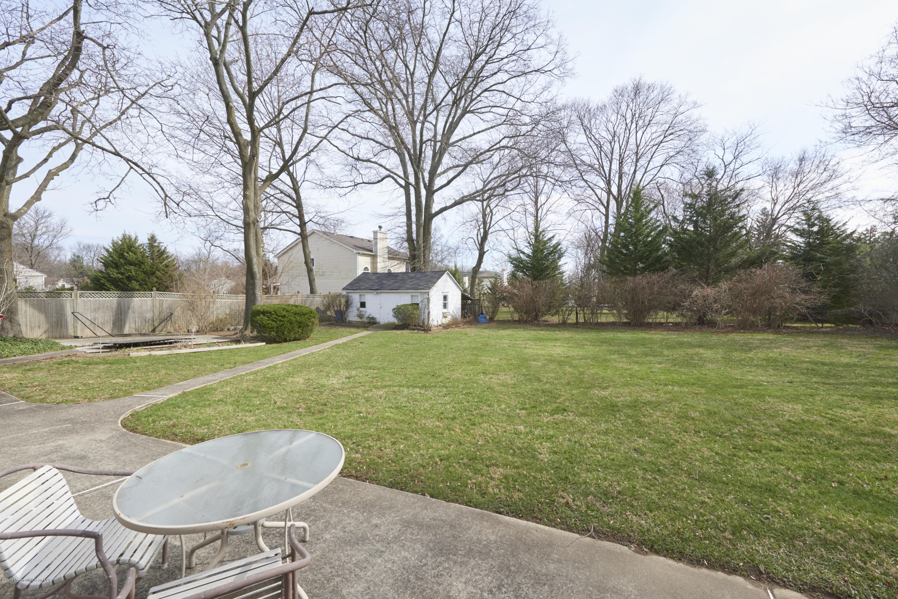 22 Maple Avenue Little Silver, NJ 07739 - Photo 20 of 25 a backyard of a house with table and chairs