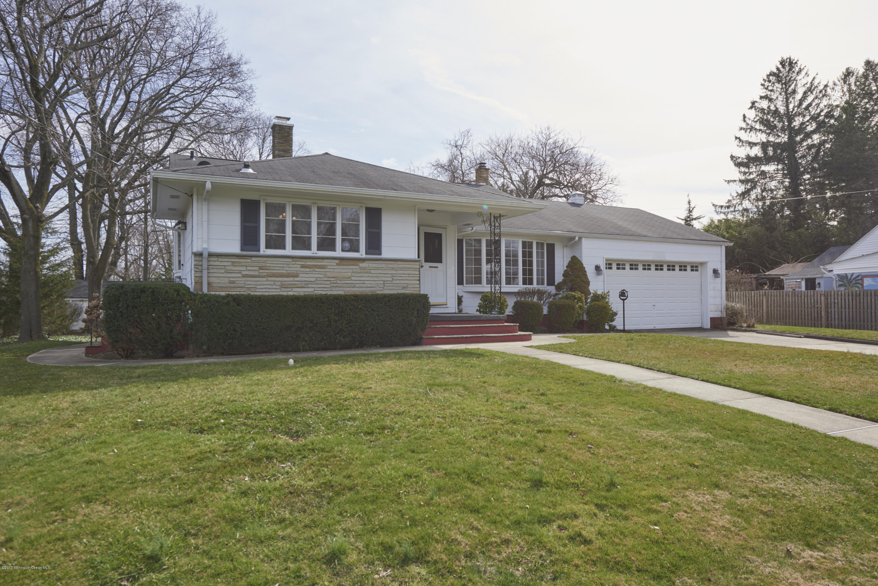 22 Maple Avenue Little Silver, NJ 07739 - Photo 25 of 25 a front view of a house with a garden and yard