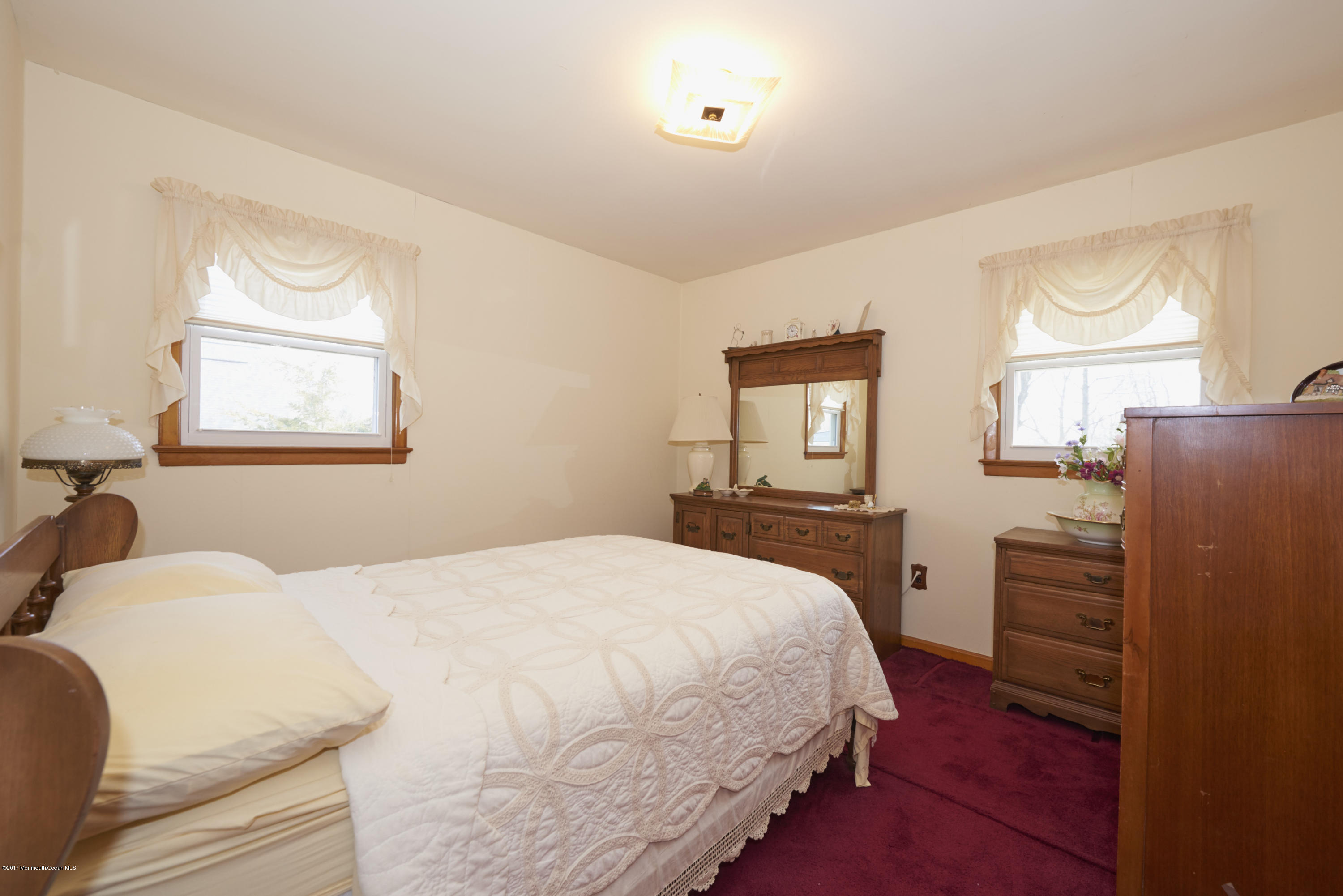22 Maple Avenue Little Silver, NJ 07739 - Photo 8 of 25 a bedroom with a bed and wooden floor