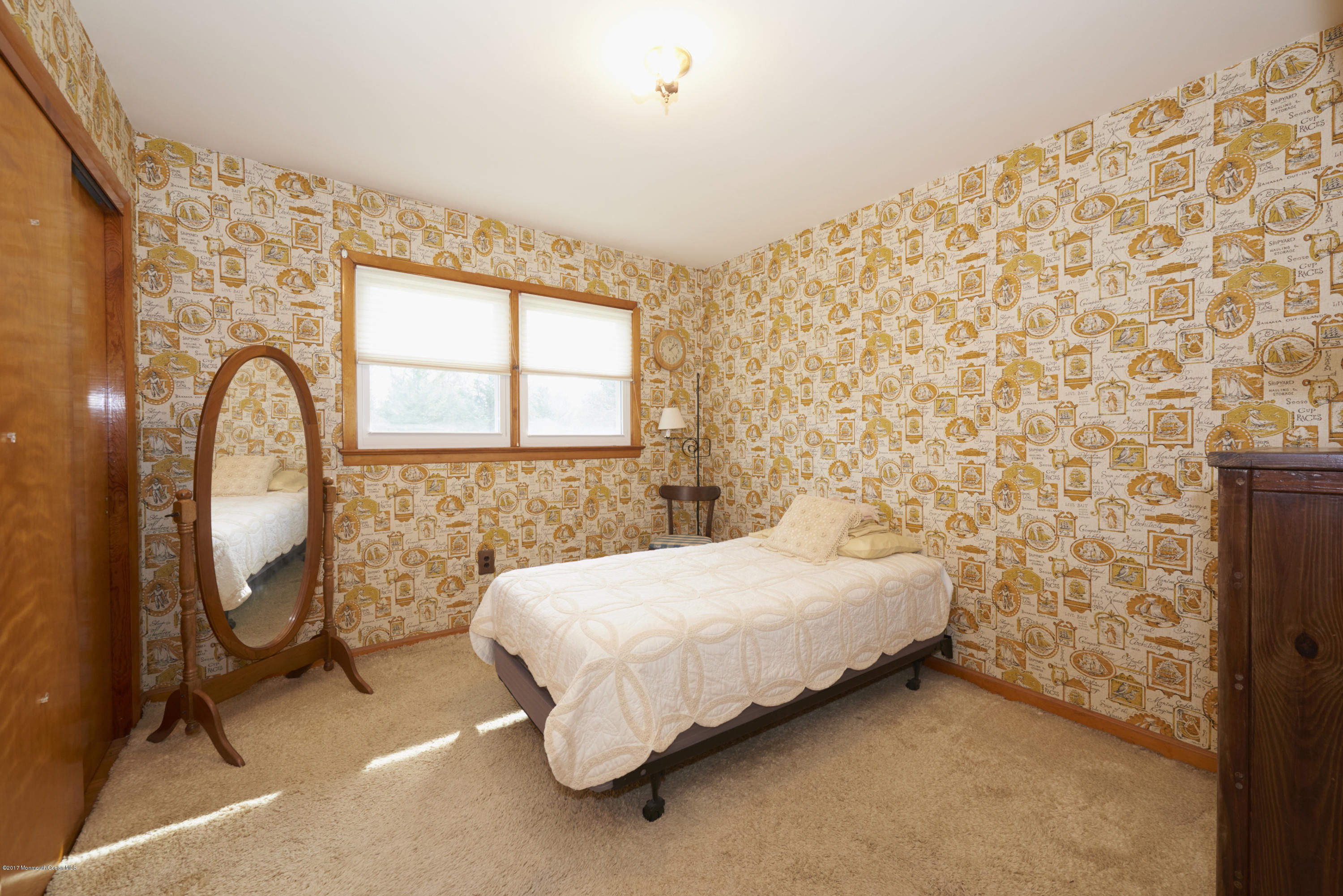 22 Maple Avenue Little Silver, NJ 07739 - Photo 9 of 25 a bedroom with a bed and a mirror