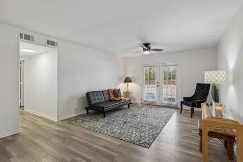 a living room with furniture and a table