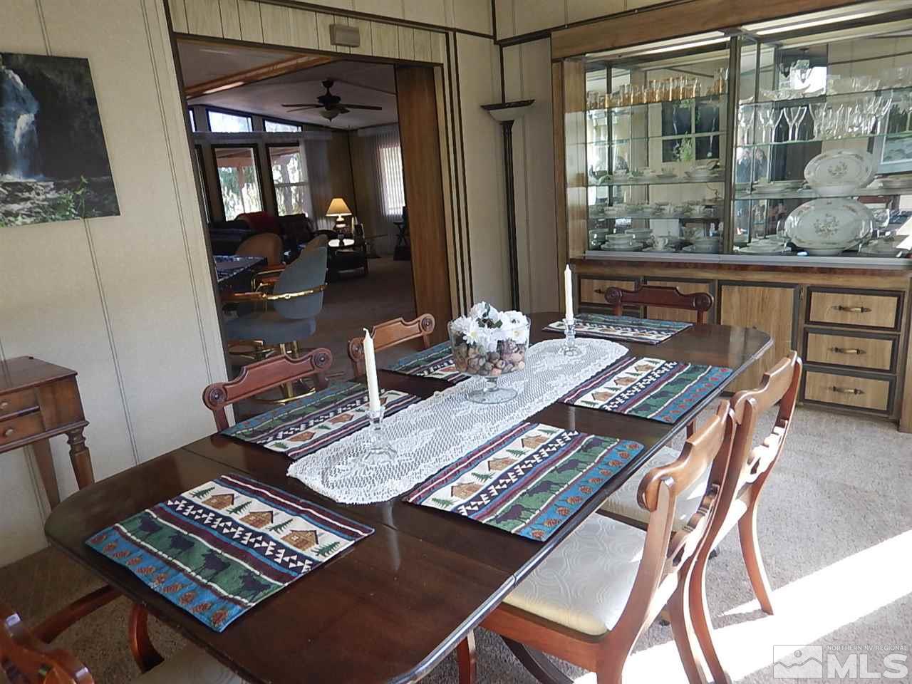 15292 Starr Grove Way Reno, NV 89521 - Photo 8 of 25 a table and chairs in front of a window
