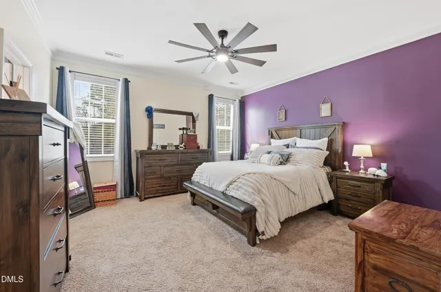 a bedroom with a bed and dresser